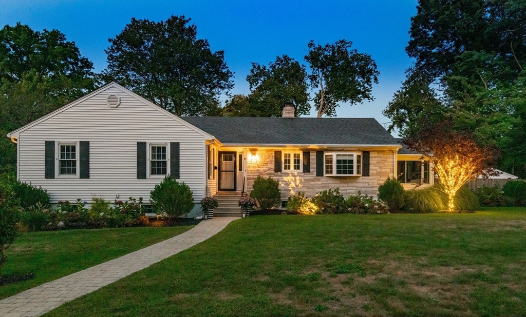 19 Longbow Road Lynnfield, MA 01940 - Photo 2 of 41 a front view of a house with a yard and green space