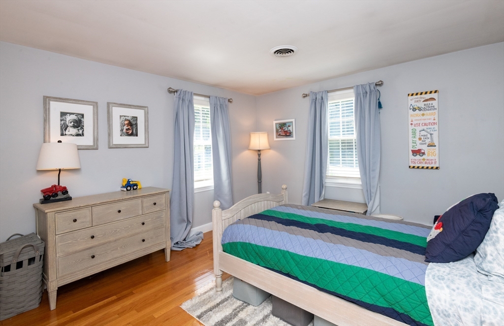 19 Longbow Road Lynnfield, MA 01940 - Photo 23 of 41 a bedroom with a bed and a window