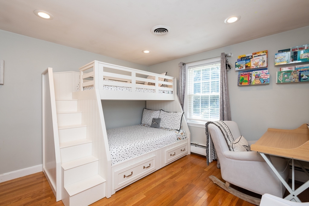 19 Longbow Road Lynnfield, MA 01940 - Photo 24 of 41 a bedroom with a bed and a chair