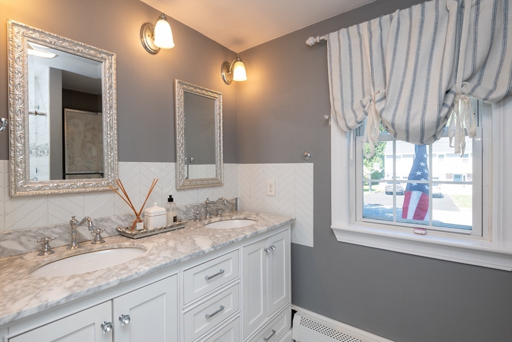 19 Longbow Road Lynnfield, MA 01940 - Photo 26 of 41 a bathroom with a granite countertop sink and a mirror