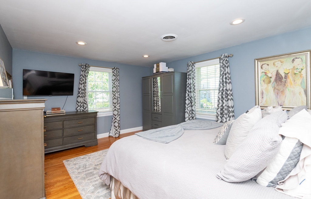 19 Longbow Road Lynnfield, MA 01940 - Photo 29 of 41 a spacious bedroom with a bed and a flat screen tv