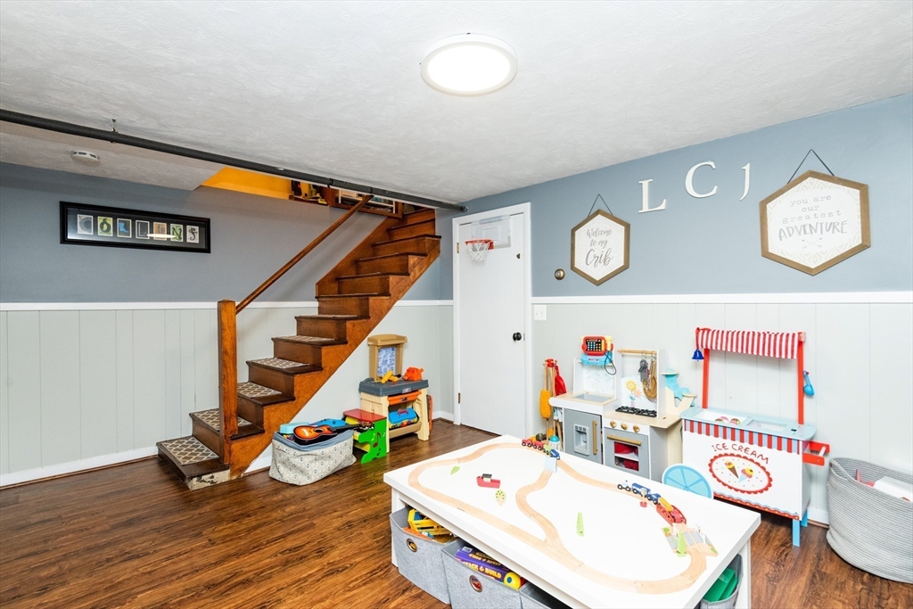 19 Longbow Road Lynnfield, MA 01940 - Photo 31 of 41 a room with furniture and a wooden floor