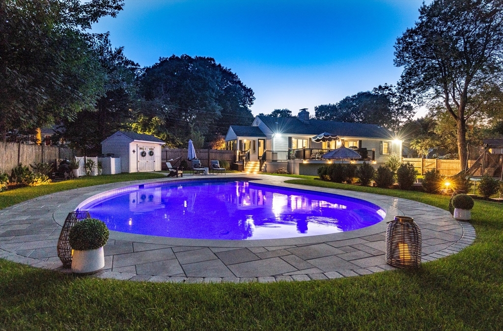 19 Longbow Road Lynnfield, MA 01940 - Photo 40 of 41 a view of swimming pool with red chairs and table in the patio