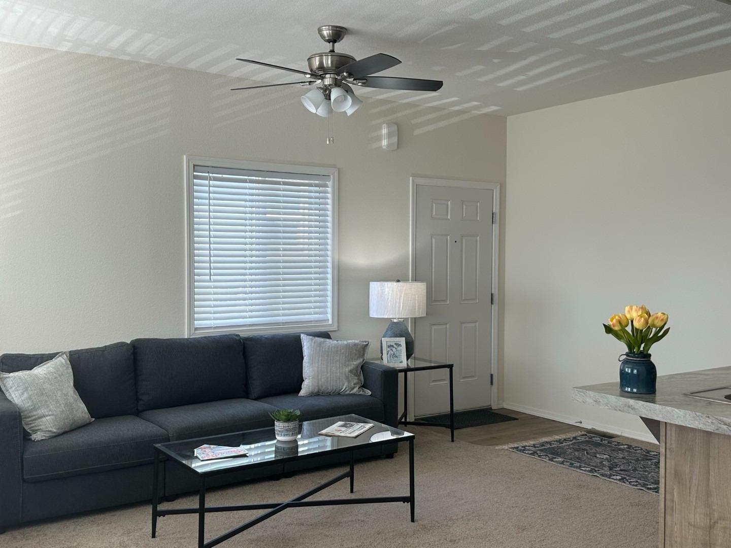 5812 Cedars Road, Unit 3 Redding, CA 96001 - Photo 6 of 14 a living room with furniture a window and a lamp