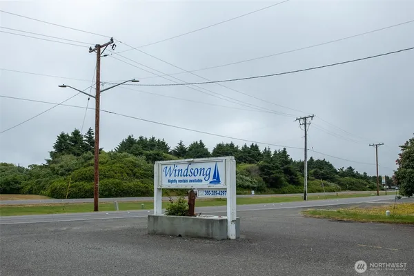 a view of a street with a sign board