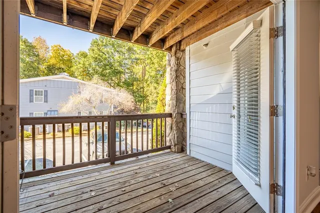 a view of balcony with wooden floor