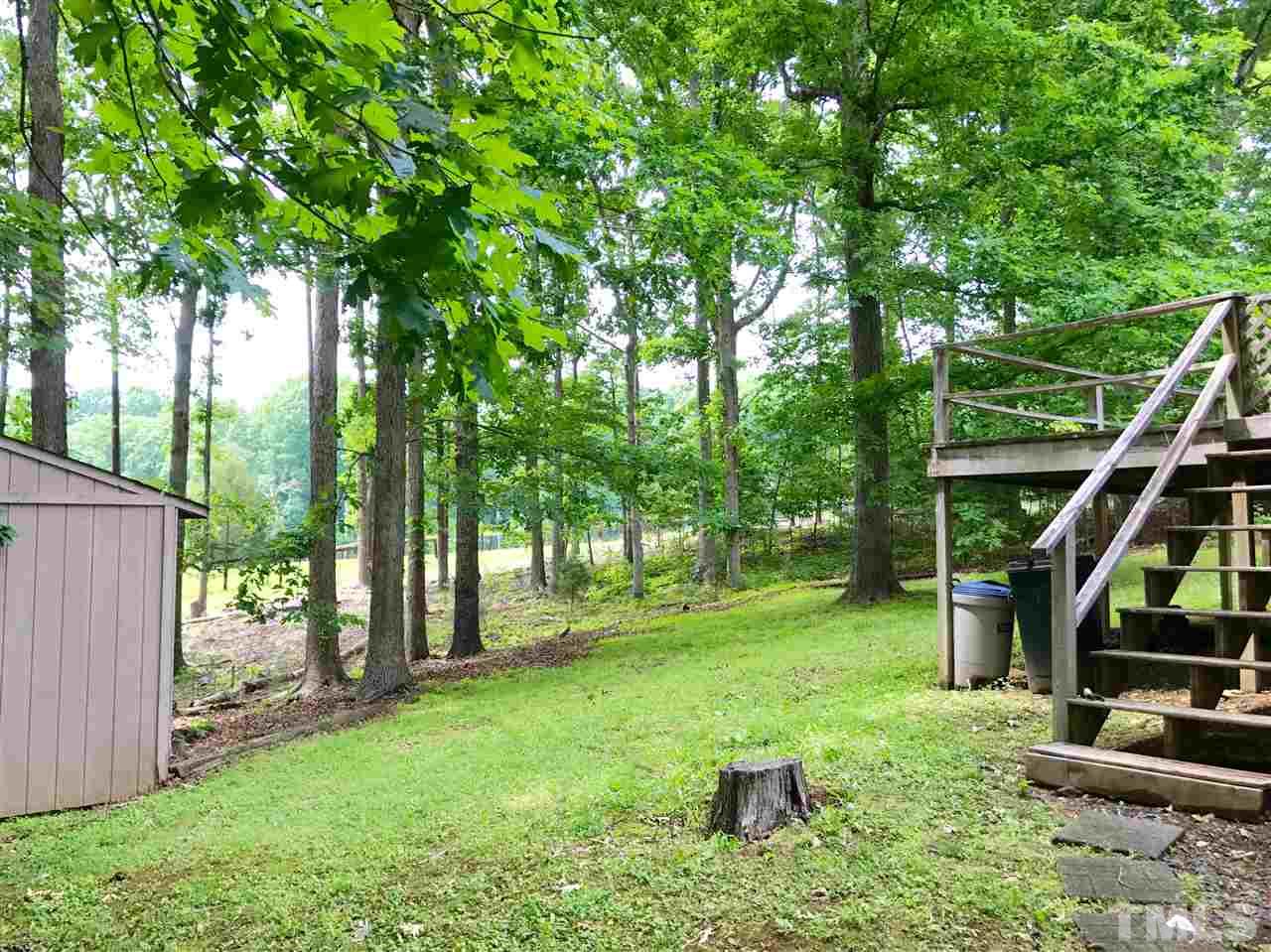 5617 Novaglen Road Durham, NC 27712 - Photo 4 of 4 a view of a house with a backyard