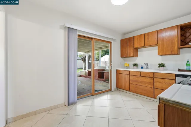 a kitchen with a stove a sink and a refrigerator