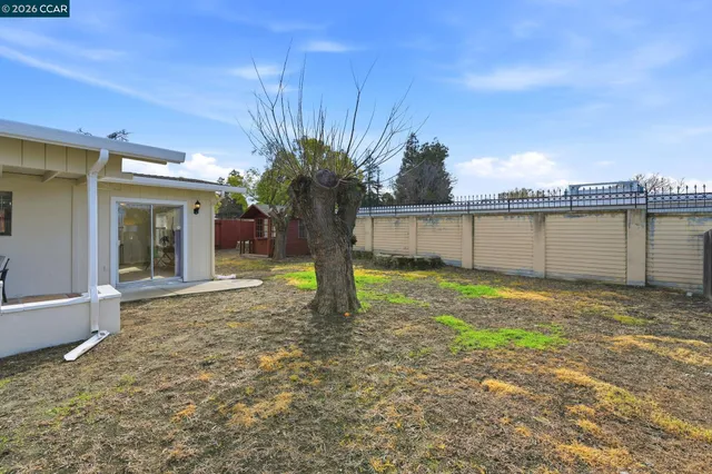 a view of a backyard with a lake view