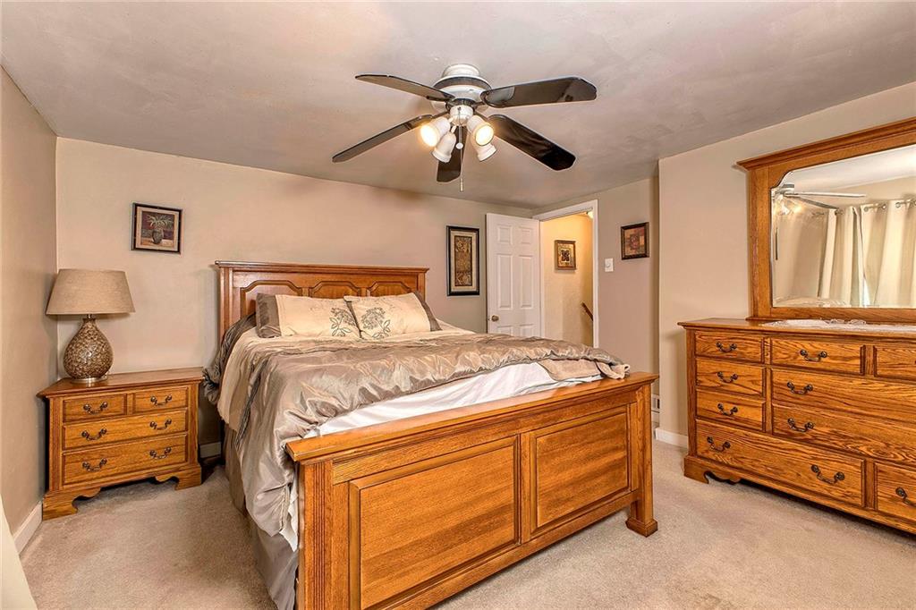 8002 Hayward Street Irwin, PA 15642 - Photo 17 of 31 a bedroom with a bed and a ceiling fan