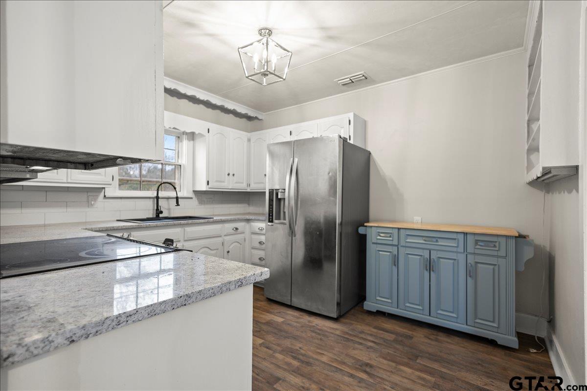 2707 Dudley Road Kilgore, TX 75662 - Photo 11 of 29 a kitchen with stainless steel appliances granite countertop a refrigerator and a sink