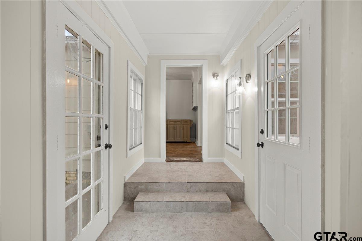 2707 Dudley Road Kilgore, TX 75662 - Photo 12 of 29 a view of a hallway with wooden floor and staircase