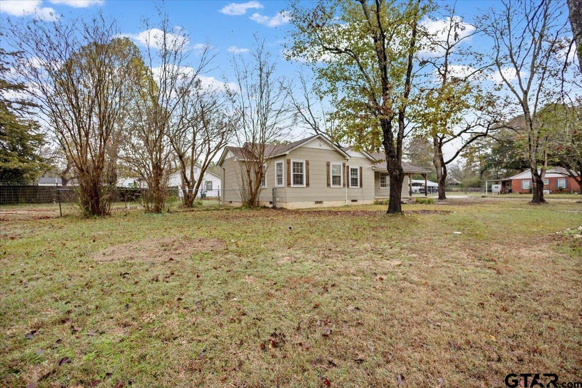 2707 Dudley Road Kilgore, TX 75662 - Photo 2 of 29 a front view of a house with a yard covered with snow