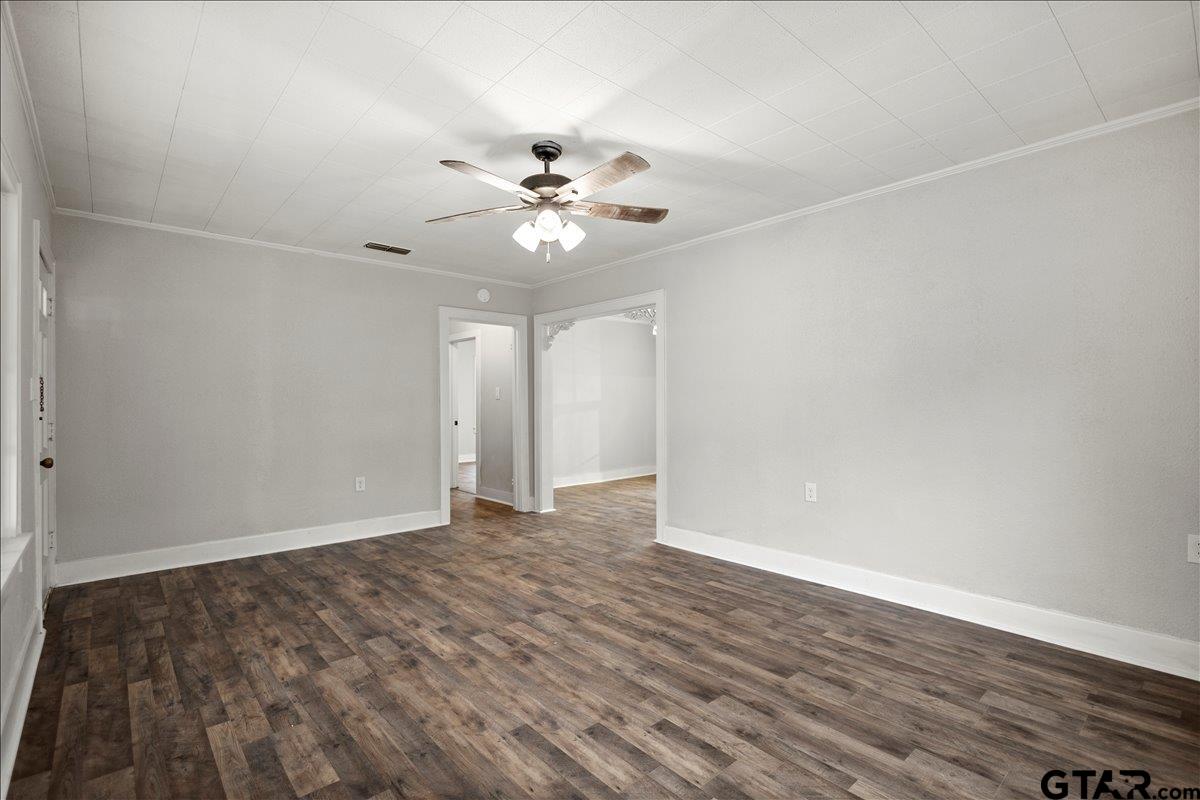 2707 Dudley Road Kilgore, TX 75662 - Photo 7 of 29 wooden floor in an empty room