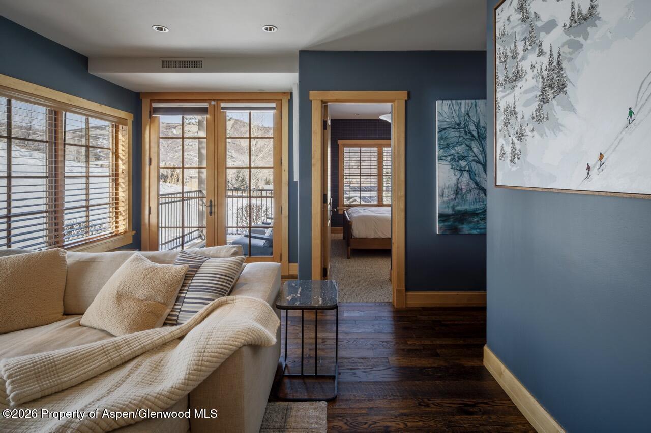 425 Wood Road, Unit 58F Snowmass Village, CO 81615 - Photo 13 of 32 a living room with furniture and a large window