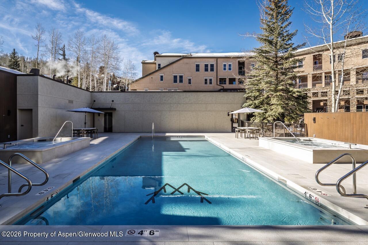 425 Wood Road, Unit 58F Snowmass Village, CO 81615 - Photo 31 of 32 a view of a swimming pool with a patio