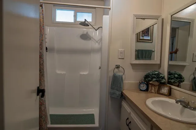 a bathroom with a sink and mirror