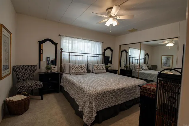 a bed room with a bed and a chandelier