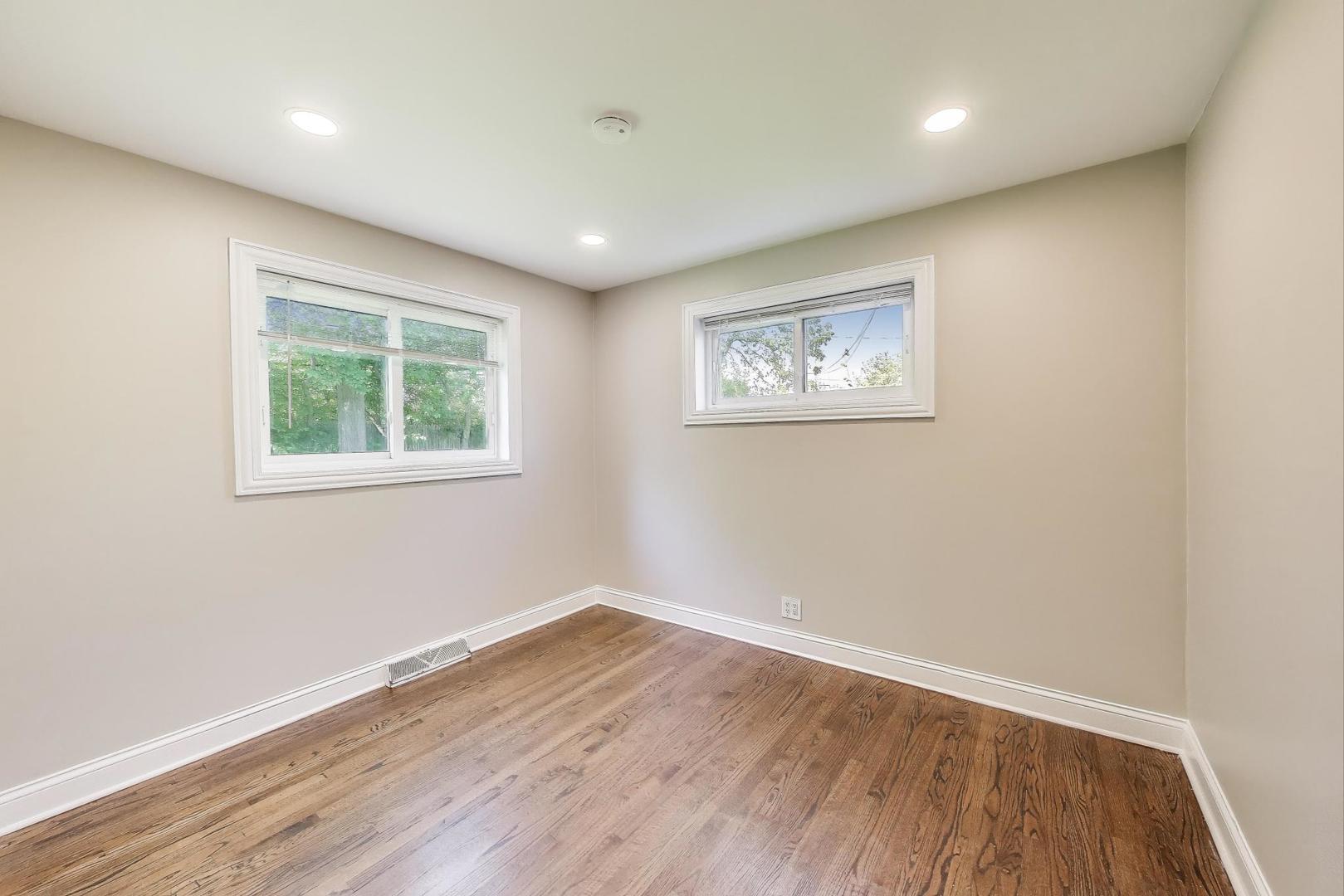 600 Long Road Glenview, IL 60025 - Photo 14 of 33 a view of a room with wooden floor and window