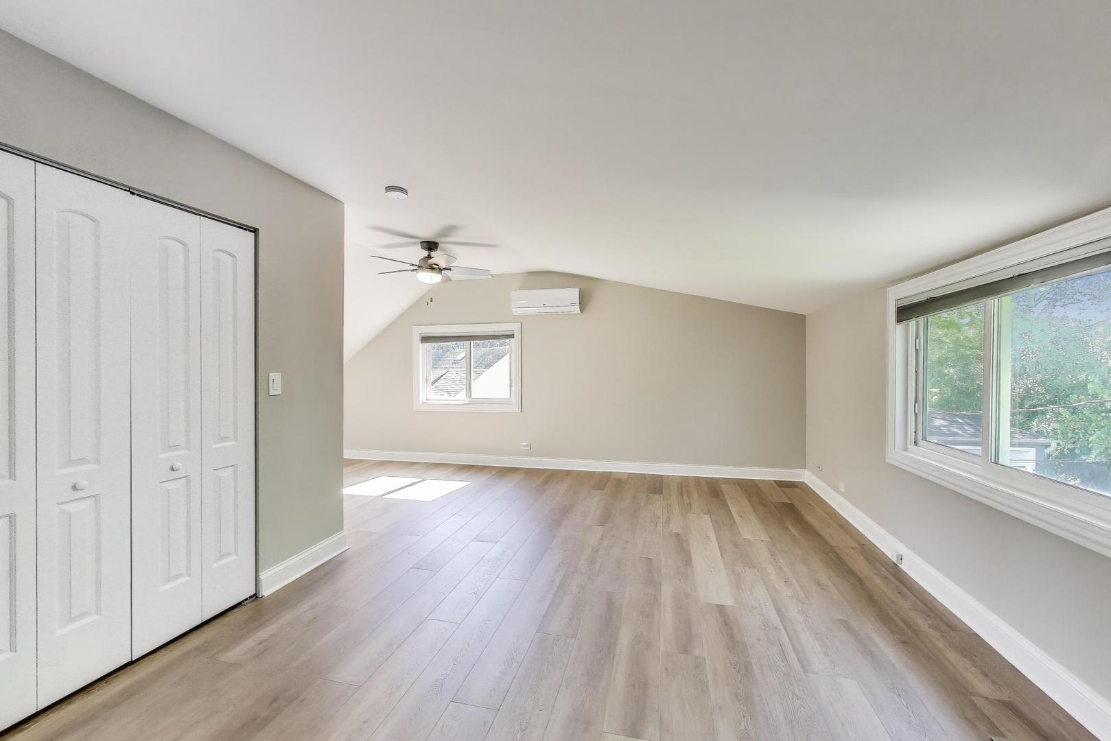 600 Long Road Glenview, IL 60025 - Photo 19 of 33 an empty room with wooden floor and windows