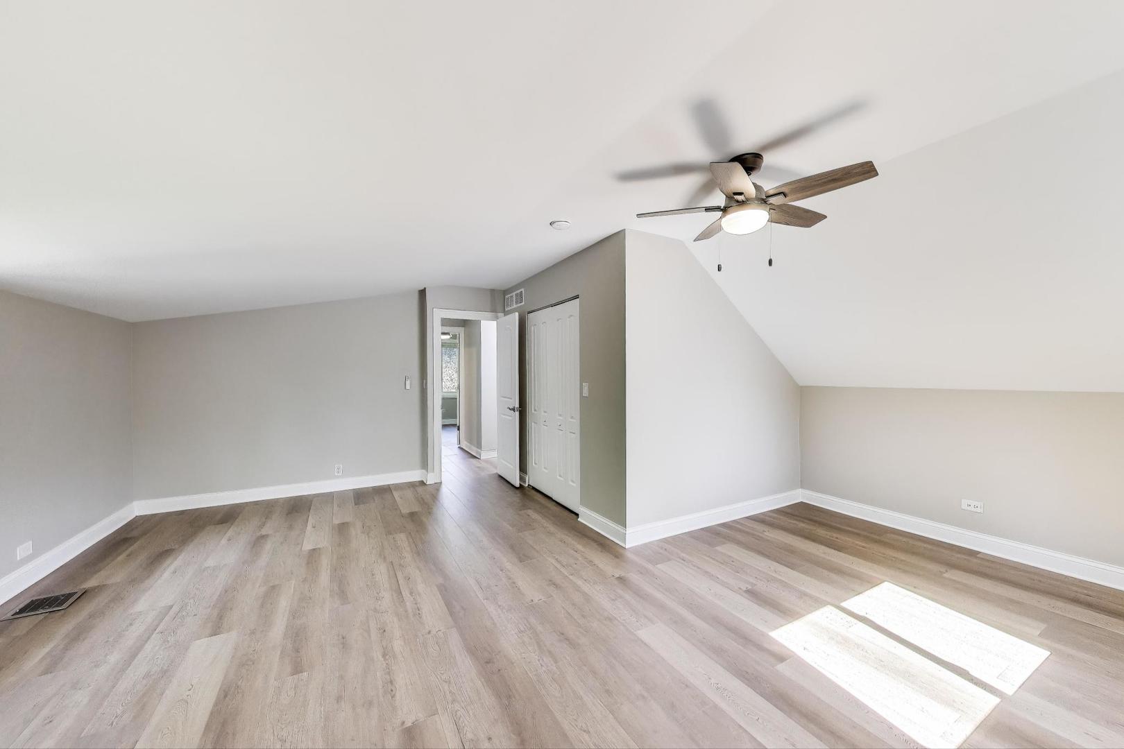 600 Long Road Glenview, IL 60025 - Photo 20 of 33 wooden floor in an empty room with a window