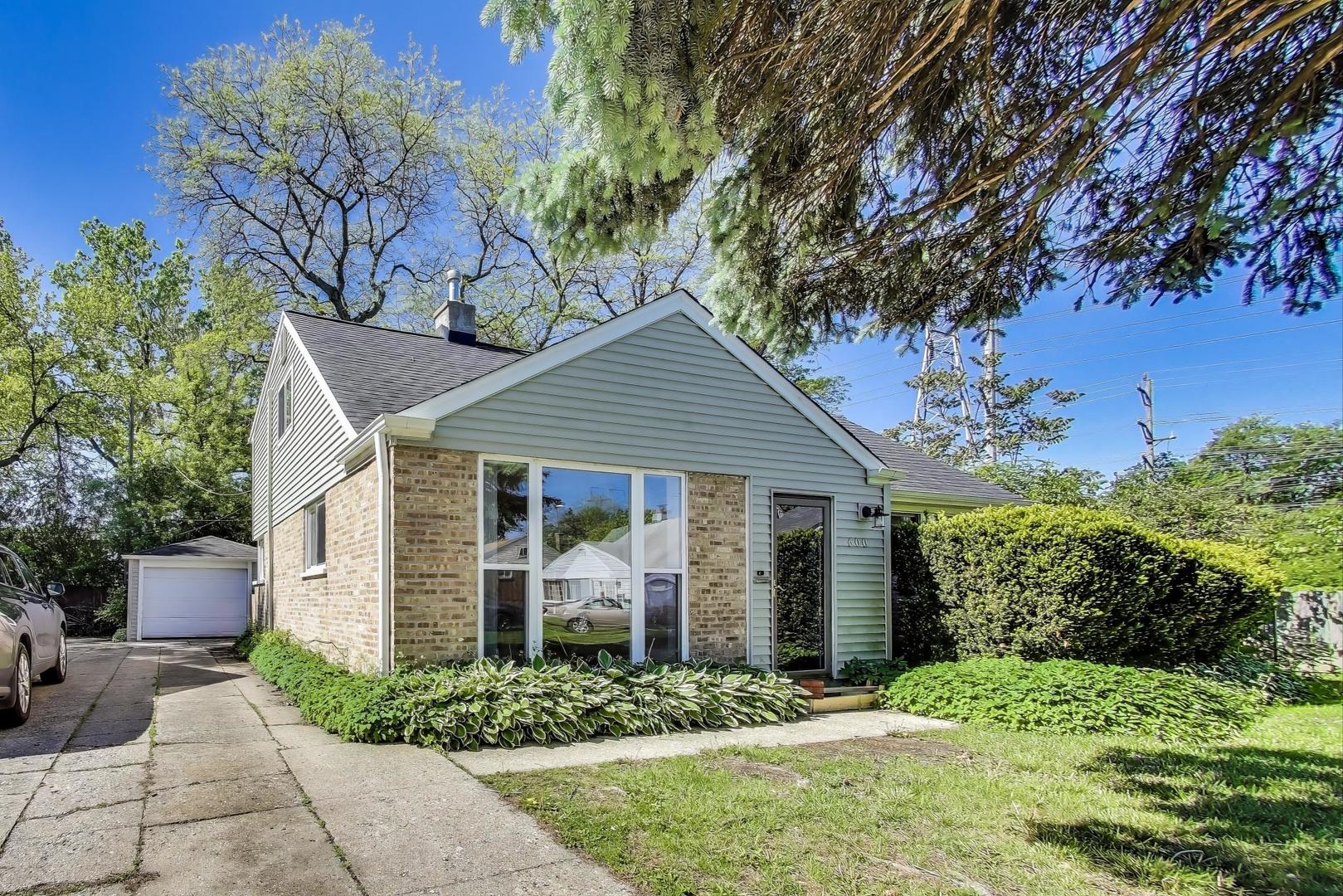 600 Long Road Glenview, IL 60025 - Photo 2 of 33 a front view of a house with a garden