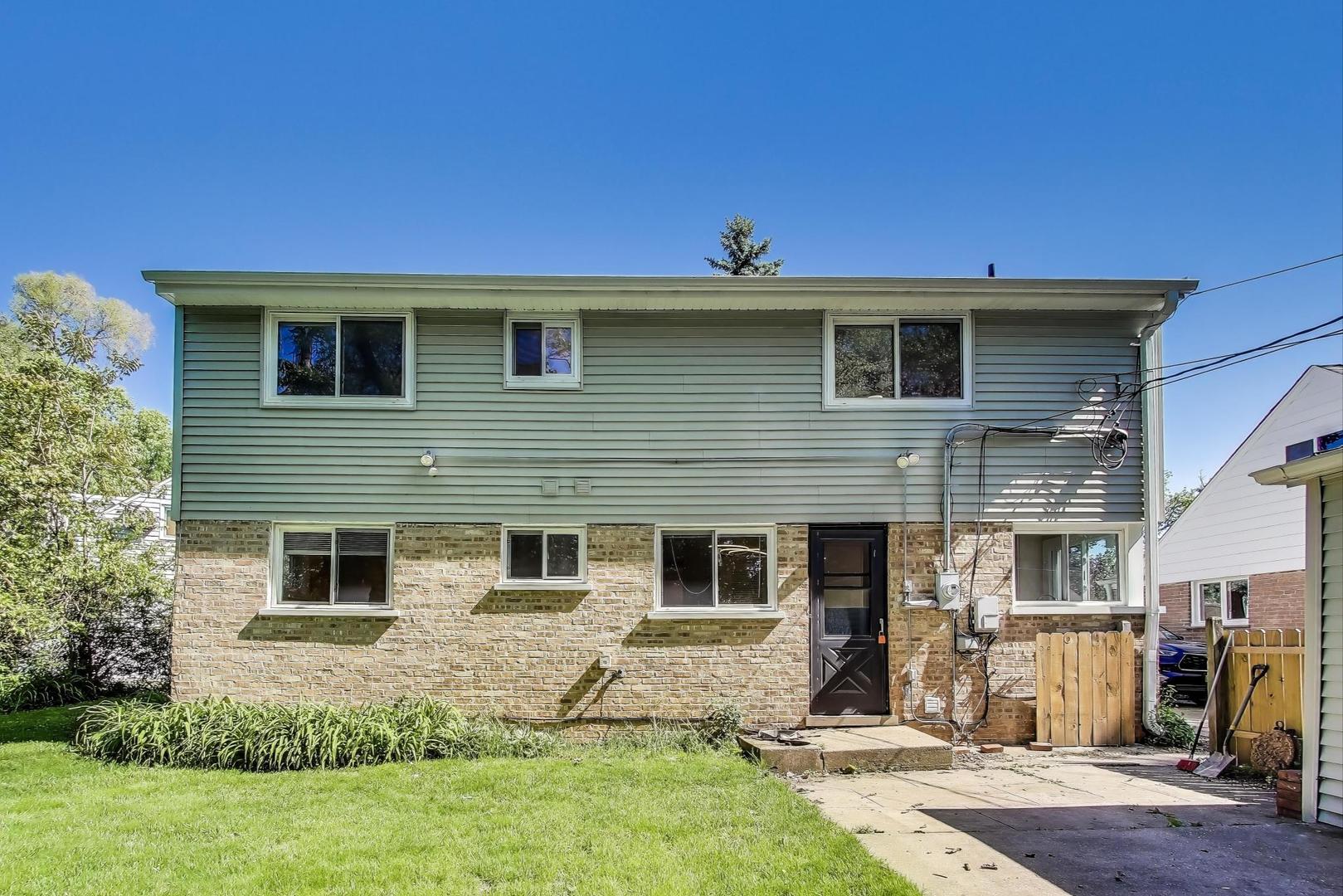 600 Long Road Glenview, IL 60025 - Photo 26 of 33 a view of a house with a yard