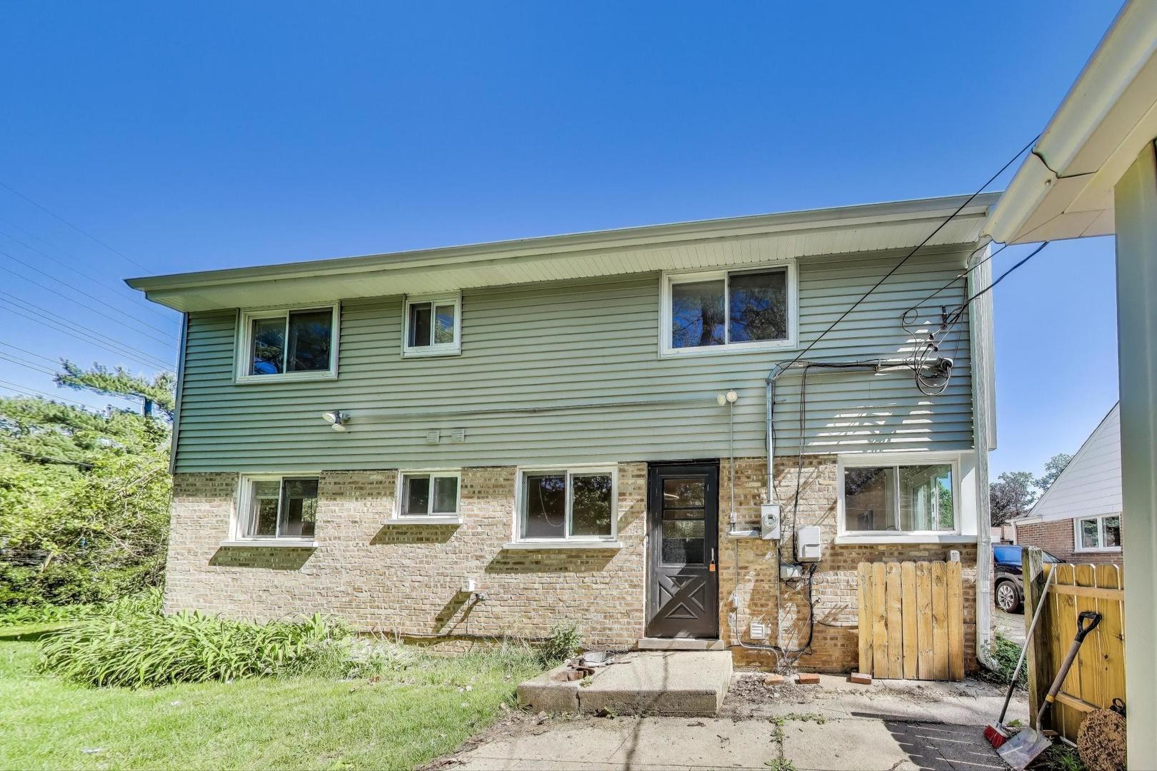 600 Long Road Glenview, IL 60025 - Photo 27 of 33 a front view of a house with a yard