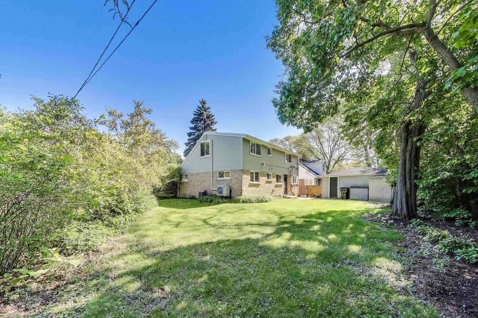 600 Long Road Glenview, IL 60025 - Photo 31 of 33 a yellow house in middle of the green field