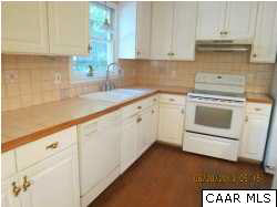 1099 Kingsway Road Afton, VA 22920 - Photo 9 of 21 a kitchen with granite countertop white cabinets and white appliances