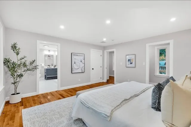 a bedroom with a large bed and a couch