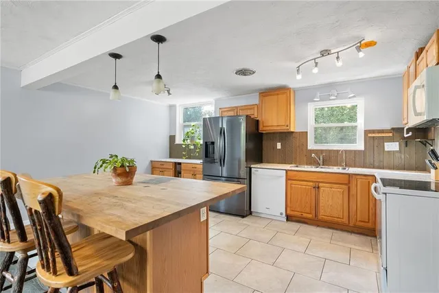 a view of a dining room with furniture and a large window