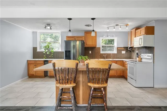 a view of a dining room with furniture and window