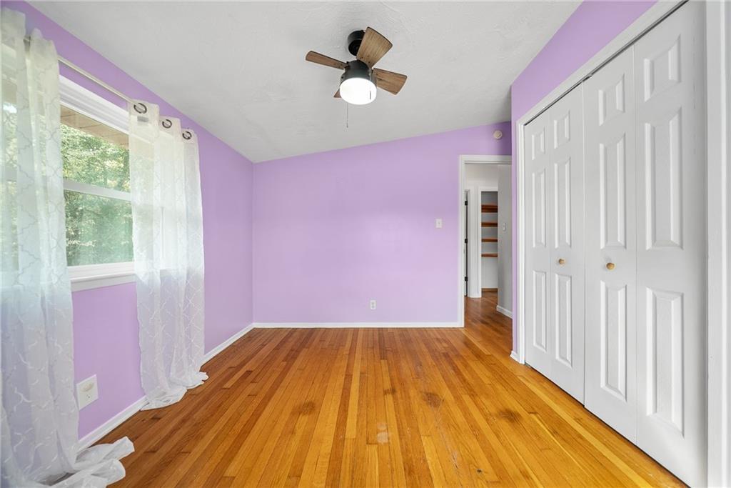 211 Stuber Road New Brighton, PA 15066 - Photo 18 of 33 a view of empty room with wooden floor and fan