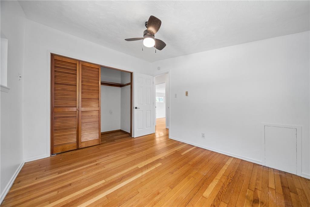 211 Stuber Road New Brighton, PA 15066 - Photo 20 of 33 a view of empty room with wooden floor and fan