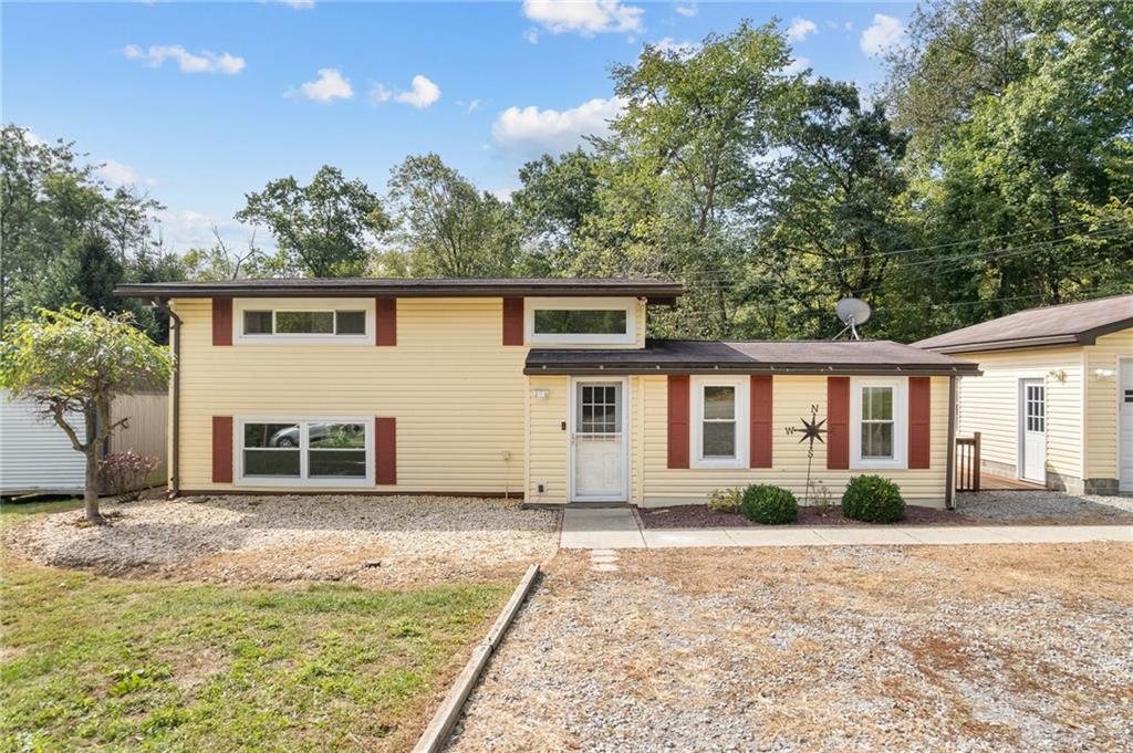 211 Stuber Road New Brighton, PA 15066 - Photo 2 of 33 a front view of a house with a yard and potted plants