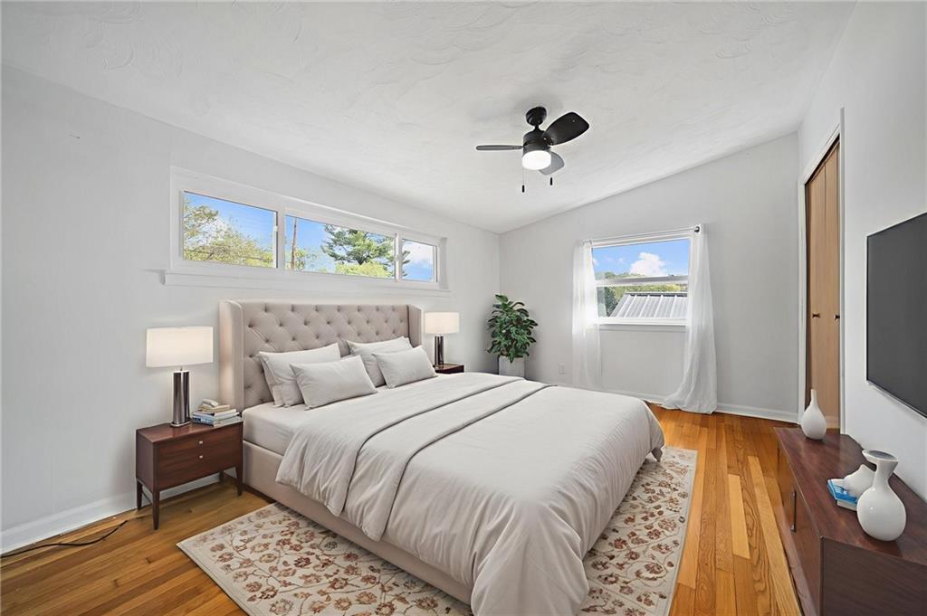 211 Stuber Road New Brighton, PA 15066 - Photo 24 of 33 a bedroom with a bed and wooden floor