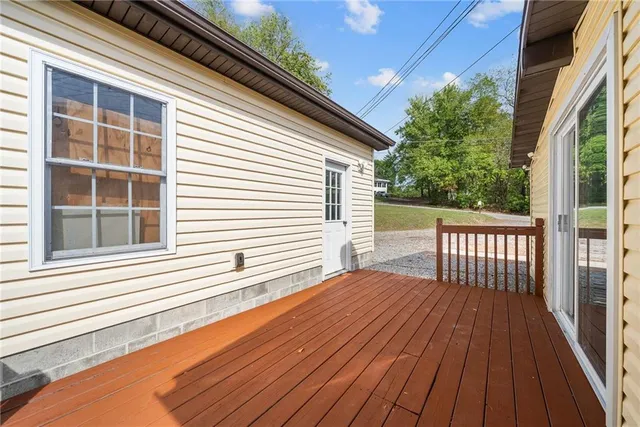 a view of backyard with a balcony