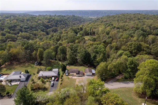 an aerial view of residential house with outdoor space