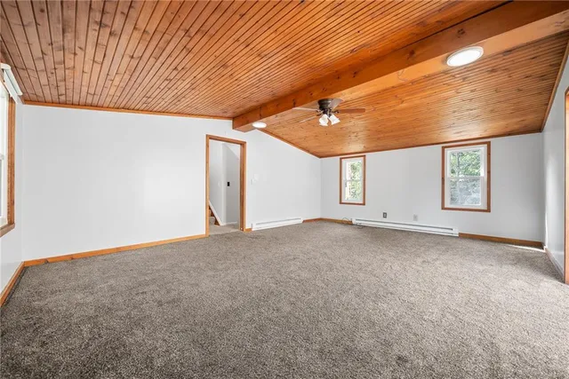 a view of a livingroom with a ceiling fan and window