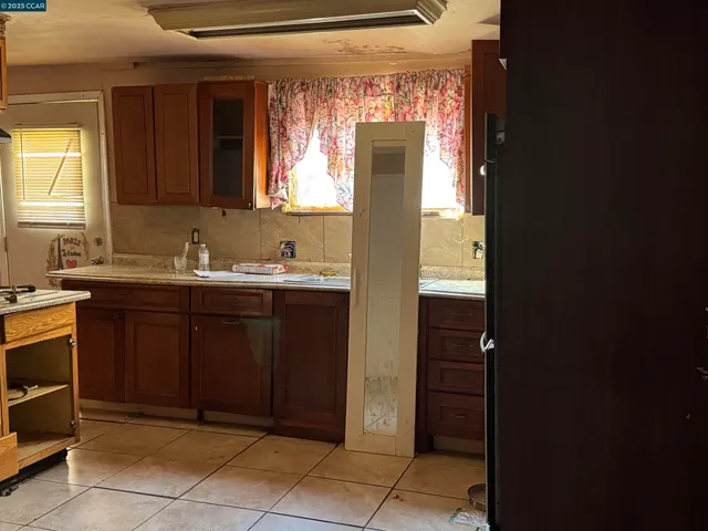 a close view of a sink and cabinets