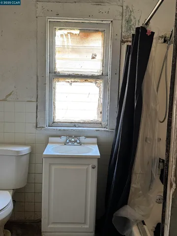 a view of an empty room and wooden floor