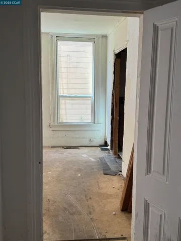 a view of an empty room with a window