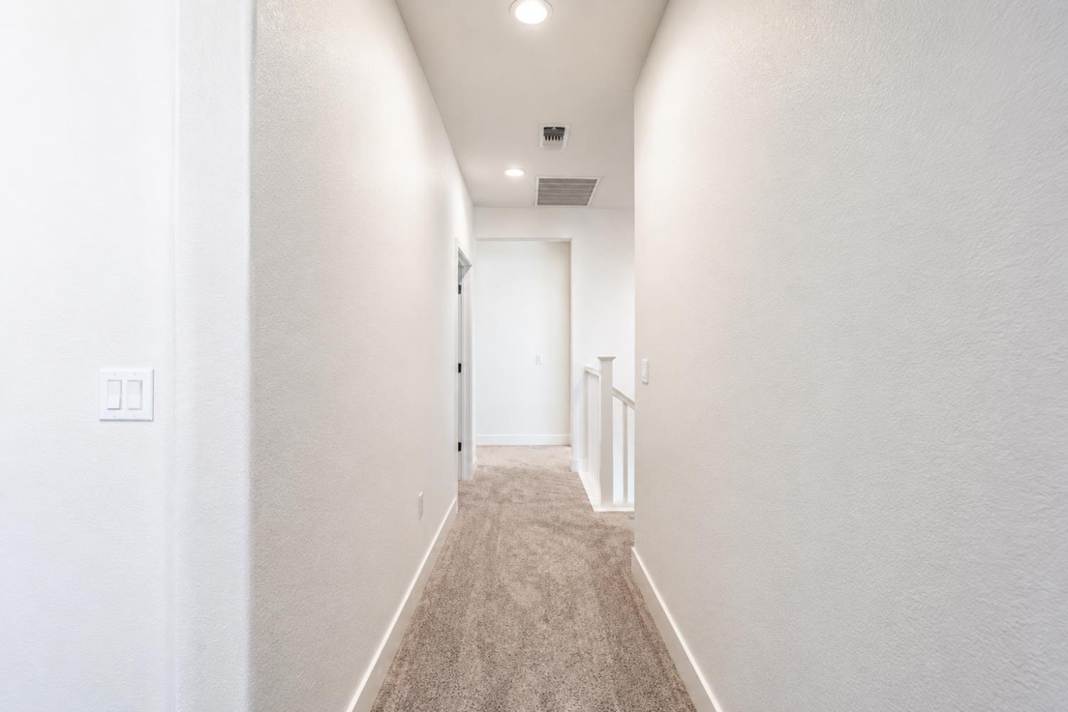 1837 South La Barbera Avenue Mountain House, CA 95391 - Photo 28 of 54 a view of a hallway with a white walls