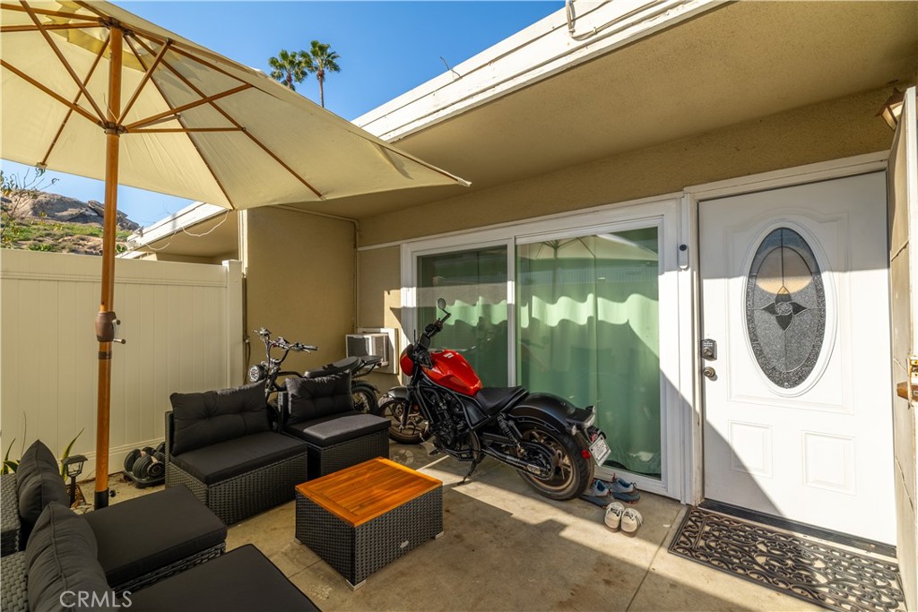 a living room with furniture a garden and a window