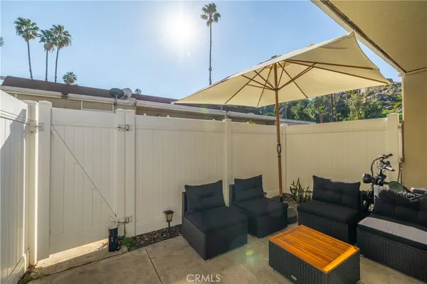 a living room with furniture and a umbrella