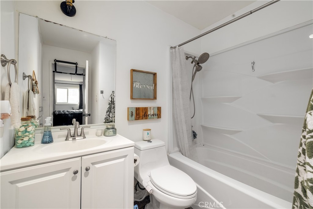 3088 Panorama Road, Unit D Riverside, CA 92506 - Photo 12 of 13 a bathroom with a sink toilet and shower