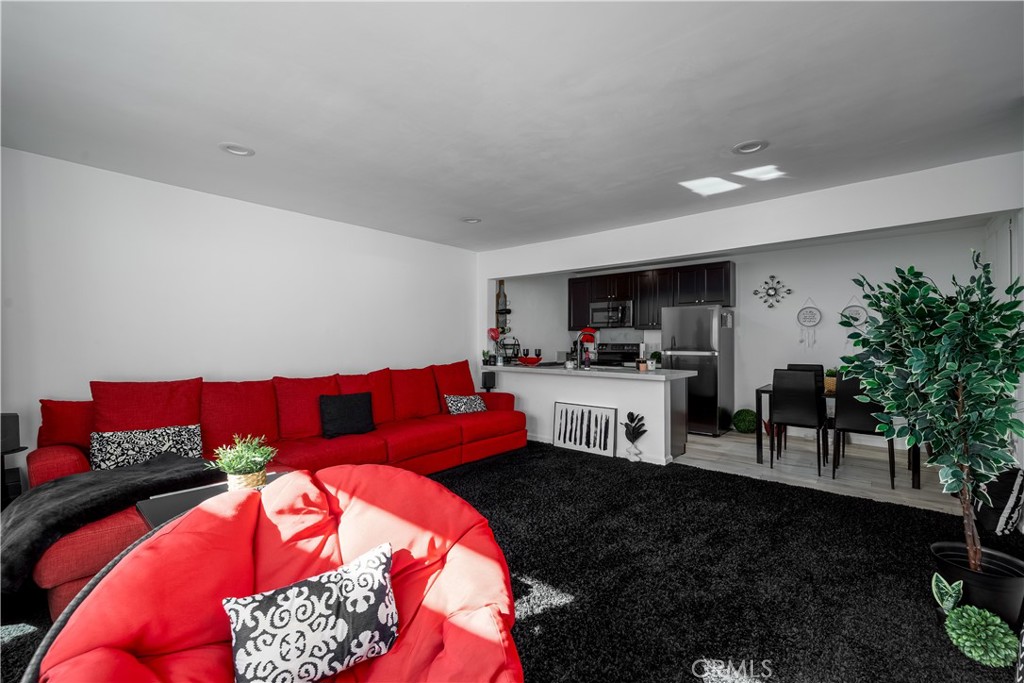3088 Panorama Road, Unit D Riverside, CA 92506 - Photo 3 of 13 a living room with furniture and a kitchen