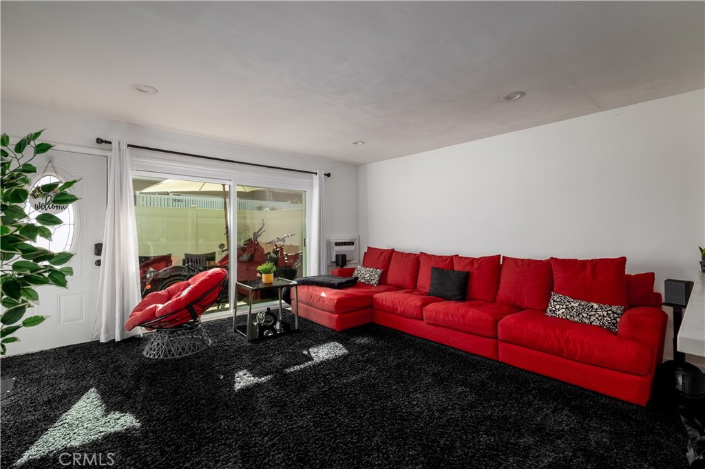 3088 Panorama Road, Unit D Riverside, CA 92506 - Photo 4 of 13 a living room with furniture with floor to ceiling window and potted plants