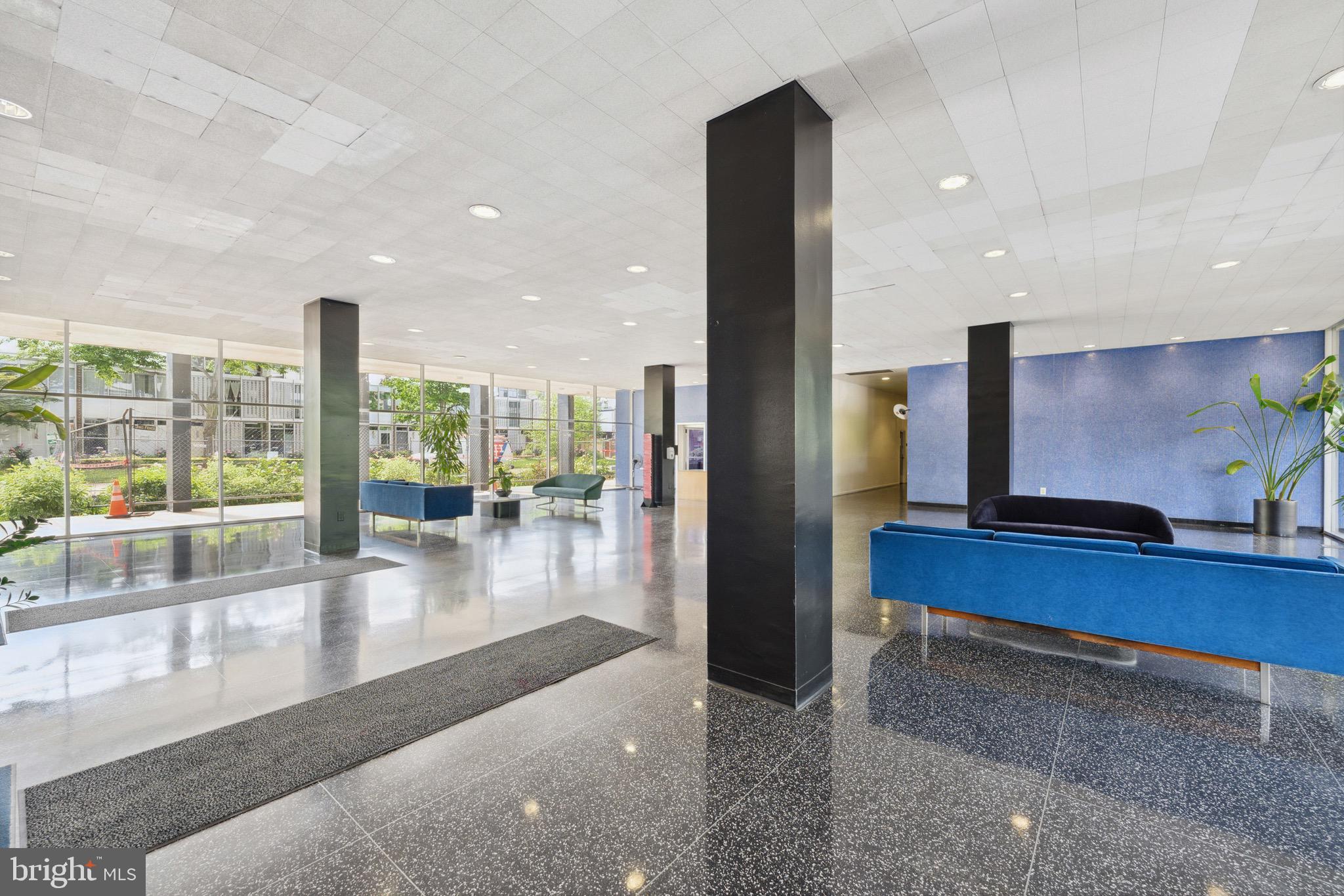 1301 Delaware Avenue Southwest, Unit N403 Washington, DC 20024 - Photo 14 of 14 a lobby with furniture and floor to ceiling window